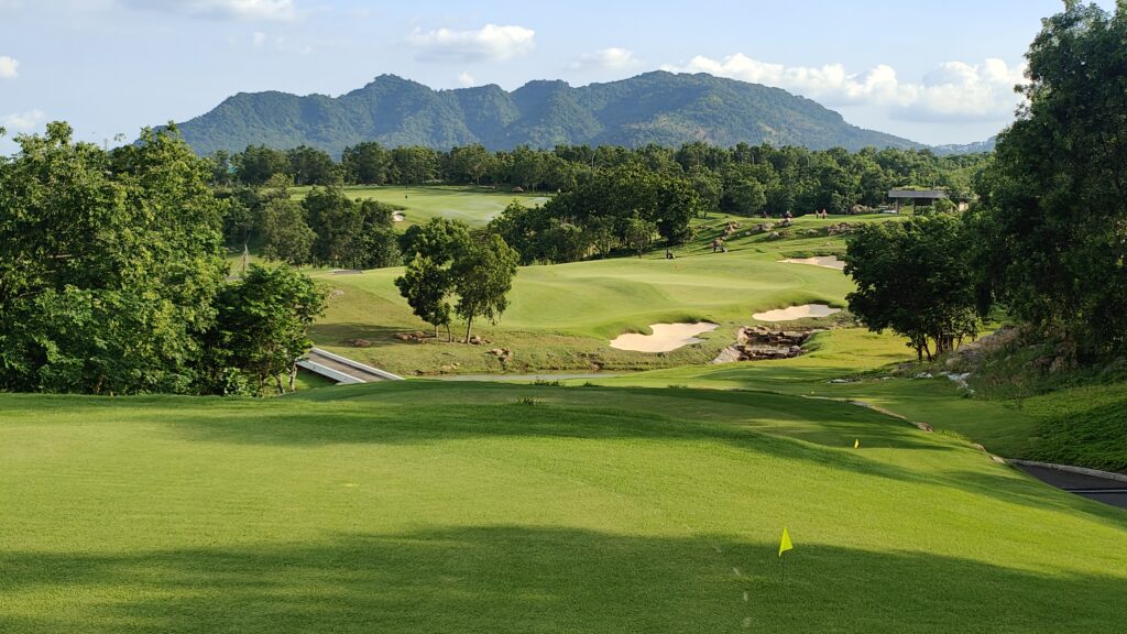 Golf course with ball near flag